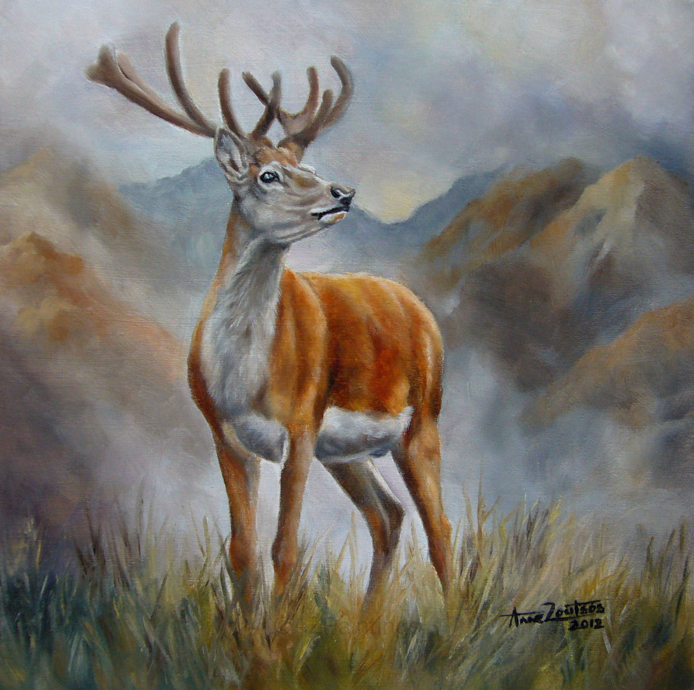 A majestic stag standing in a misty mountain landscape